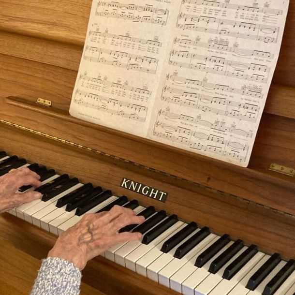 Client playing the piano